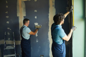 Construction Crew Working in Apartment